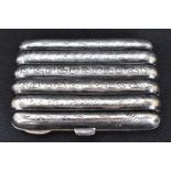 An Edwardian hallmarked silver six-tube cigarette case, with floral decoration front and back, 8.2 x