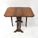An Edwardian mahogany Sutherland table of small proportions, raised on turned and stretchered