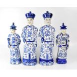 A set of four (two pairs) of mid-20th century Oriental blue and white figures of Chinese scholars,