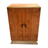 A 1930s Art Deco small linen chest, with double door mounted on stepped tapered base, 115 x 80 x