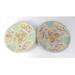 H. J. WOOD LTD; a pair of floral decorated chargers, diameter 41cm (2).