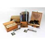 A large collection of microscope slides and accessories, including various books relating to