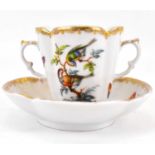 DRESDEN; a late 19th century Meissen-style chocolate cup and saucer decorated with exotic birds,