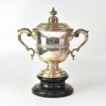 A George V hallmarked silver twin-handled lidded trophy, the stepped lid with gadrooned knop, the