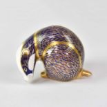 ROYAL CROWN DERBY; an Imari paperweight in the form of a Badger, with gold button, height 8cm.