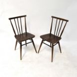 ERCOL; four dark stained stick back dining chairs, with labels (4).