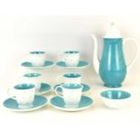 SUSIE COOPER; a fourteen-piece white and turquoise polka dot pattern coffee set, comprising coffee