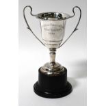 A George VI hallmarked silver trophy cup on stand, height 22cm.Condition Report: - Weight