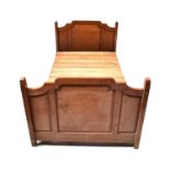 An Edwardian mahogany single bed, with metal frame and pine slats.Condition Report: Internal width