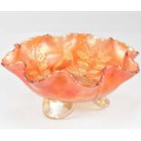 A Fenton carnival glass bowl decorated with 'Stag and Holly' pattern, with frilled edge, raised on