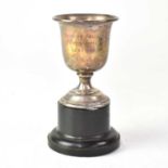A small George V hallmarked silver trophy, inscribed 'Castner Kellner Works Jubilee 1897-1947', on a