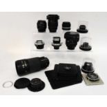 A large collection of various camera lenses to include a Schneider-Kreuznach Tele-Xenar 1:5.5/240, a