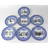 ROYAL DOULTON; seven 'Gibson Girl' plates, each with black and white panel, signed and titled