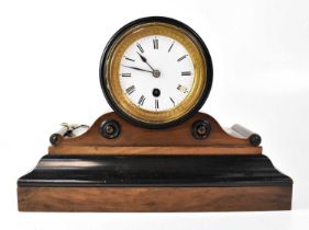 A mahogany and ebonised mantel clock, the white enamelled dial set with Roman numerals and verge