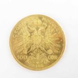A 1915 Austrian 100 Corona 0.900 fine gold (21ct) coin, 1975 restrike, diameter 36.8mm, 33.98g.
