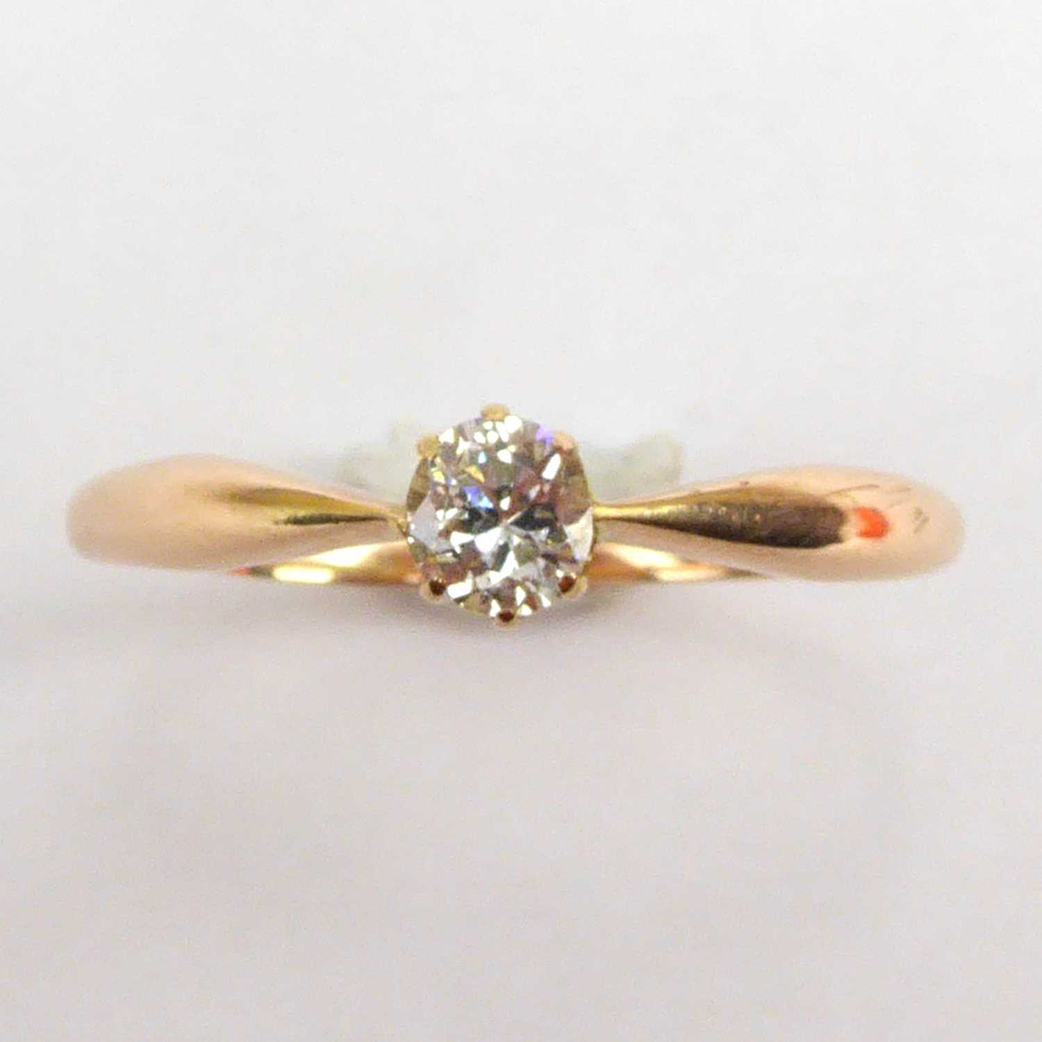 A 14ct gold claw set diamond solitaire ring, size V, approx. 2.3g.