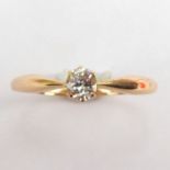 A 14ct gold claw set diamond solitaire ring, size V, approx. 2.3g.