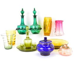 Various items of coloured glassware to include a pair of green globe and shaft style decanters and