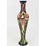 MOORCROFT; a 'Trinity' pattern vase of slender baluster form, designed by Philip Gibson, numbered