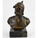 A modern bronze bust, possibly depicting Otto von Bismarck, with trademark moustache, wearing