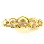 A 9ct gold dress ring with five graduated white stones, size N, approx. 2.6g. Condition Report: -