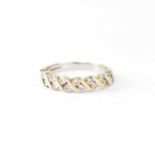 An 18ct yellow gold half eternity ring set with fourteen small diamonds, size O1/2, approx. 4.2g.