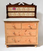An early 20th century pine chest of two short over two long drawers, raised on bun feet with