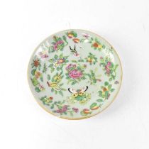 A Chinese Famille Verte plate painted with butterfly and bird within flowers, painted seal mark to