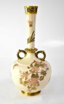 ROYAL WORCESTER; a blush ivory twin-handled onion-shaped vase with reticulated gilt-heightened