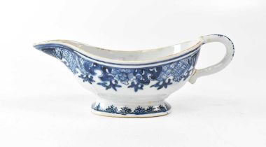A Chinese blue and white hand painted sauce boat, the interior with Willow-type pattern, height 9.