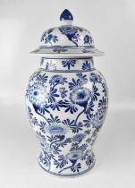 A large blue and white baluster jar and cover with all-over floral decoration, height 59cm.