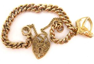 A 9ct gold bracelet with horse head pendant and heart-shaped padlock clasp, length 17cm, approx.