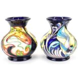 MOORCROFT; two small baluster vases with flared rims, each decorated in a different tube lined