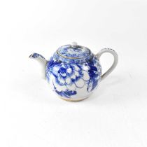 A Chinese porcelain blue and white teapot with interior strainer, painted with peonies within