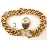 A 9ct rose gold hollow link bracelet united with a 9ct rose gold heart-shaped padlock clasp,