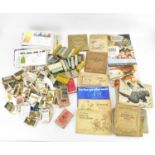 A large quantity of mixed tea and cigarette card albums, empty cigarette packets, loose cards and