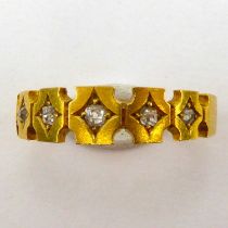 An 18ct gold band ring, the shaped head set with five gypsy set tiny diamonds, size N, approx. 3g.