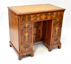 TITCHMARSH & GOODWIN, IPSWICH; a George III style yew wood small pedestal desk, with thumb-moulded