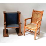An ecclesiastical beech armchair with 'IHS' carved to the back, height 105cm, also an oak bishop's