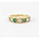 An 18ct yellow gold ring set with alternating diamonds and emeralds, size L1/2, approx. 4.7g.