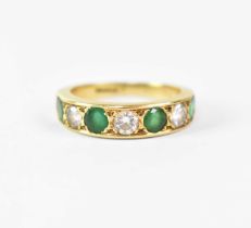 An 18ct yellow gold ring set with alternating diamonds and emeralds, size L1/2, approx. 4.7g.