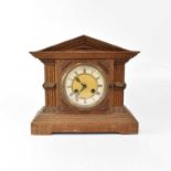 An early 20th century oak cased architectural mantel clock, with Junghans twin fusee movement