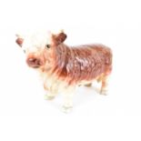 A vintage butcher's pottery countertop bull, unmarked, height 19.5cm, length 29cm. Condition Report: