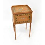 A painted satinwood single-door pot cupboard decorated with floral bouquet contained within a