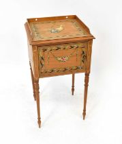A painted satinwood single-door pot cupboard decorated with floral bouquet contained within a