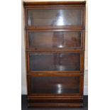 GLOBE-WERNICKE; a four-section oak 'Elastic' stacking bookcase, 160 x 87 x 31cm. Condition Report: -