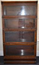 GLOBE-WERNICKE; a four-section oak 'Elastic' stacking bookcase, 160 x 87 x 31cm. Condition Report: -