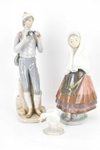 LLADRÓ; three porcelain figures comprising a mountaineer, height 33cm, girl with shawl, height