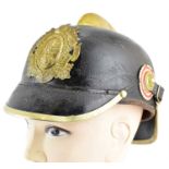 An Imperial German Hessian fireman-style helmet. Condition Report: - We cannot give any guarantee of