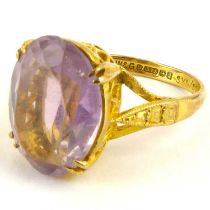 A 9ct gold amethyst dress ring, the claw set cut oval amethyst on basket cage head, size L,